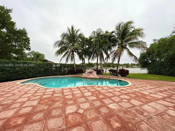 a view of swimming pool with a yard