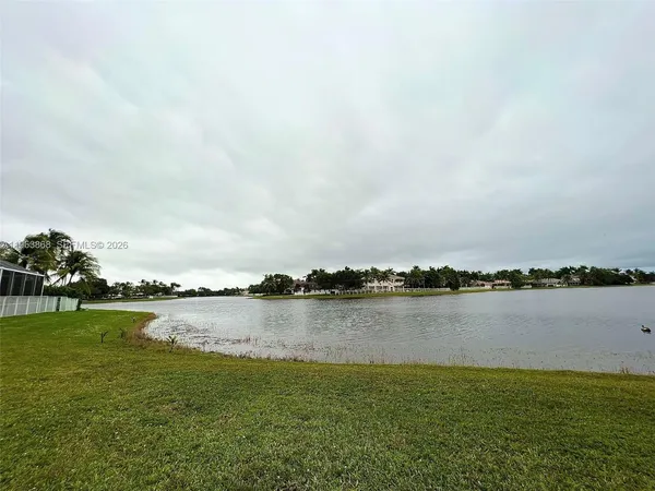 a view of a lake with houses in big room with houses