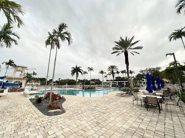 a view of a lake with outdoor seating space