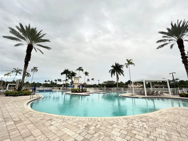 a view of a swimming pool with a lake view