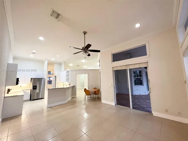a view of living room with furniture and a ceiling fan