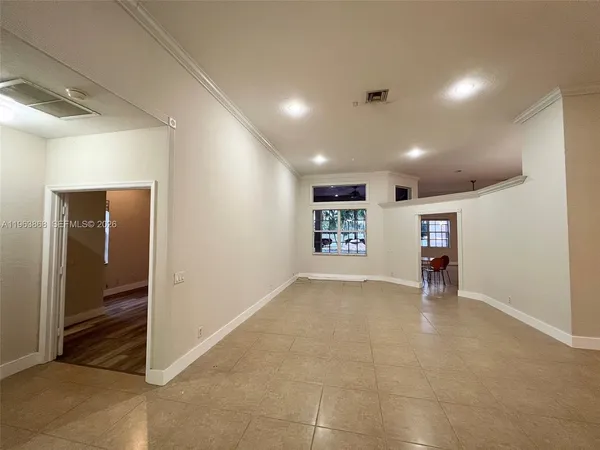 a view of an empty room with a window