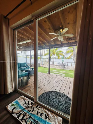 a view of a floor to room window with wooden floor