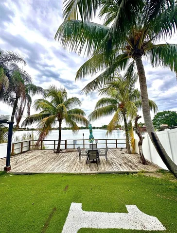 a view of a swimming pool with a garden