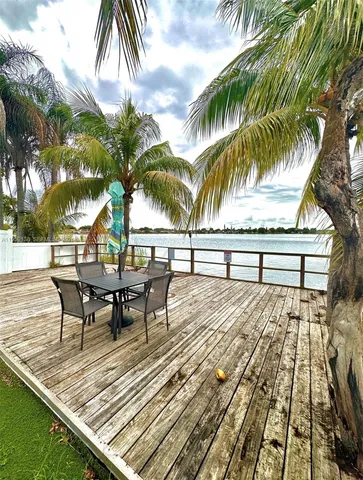 swimming pool view with a sitting space