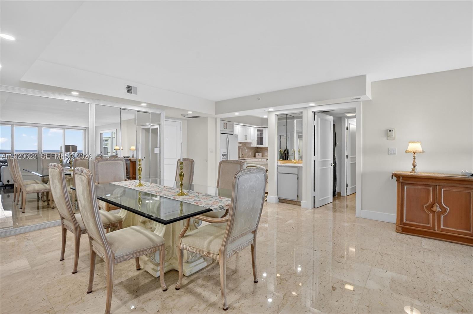 4101 North Ocean Boulevard, Unit 1605 Boca Raton, FL 33431 - Photo 9 of 35 a dining room with furniture and window