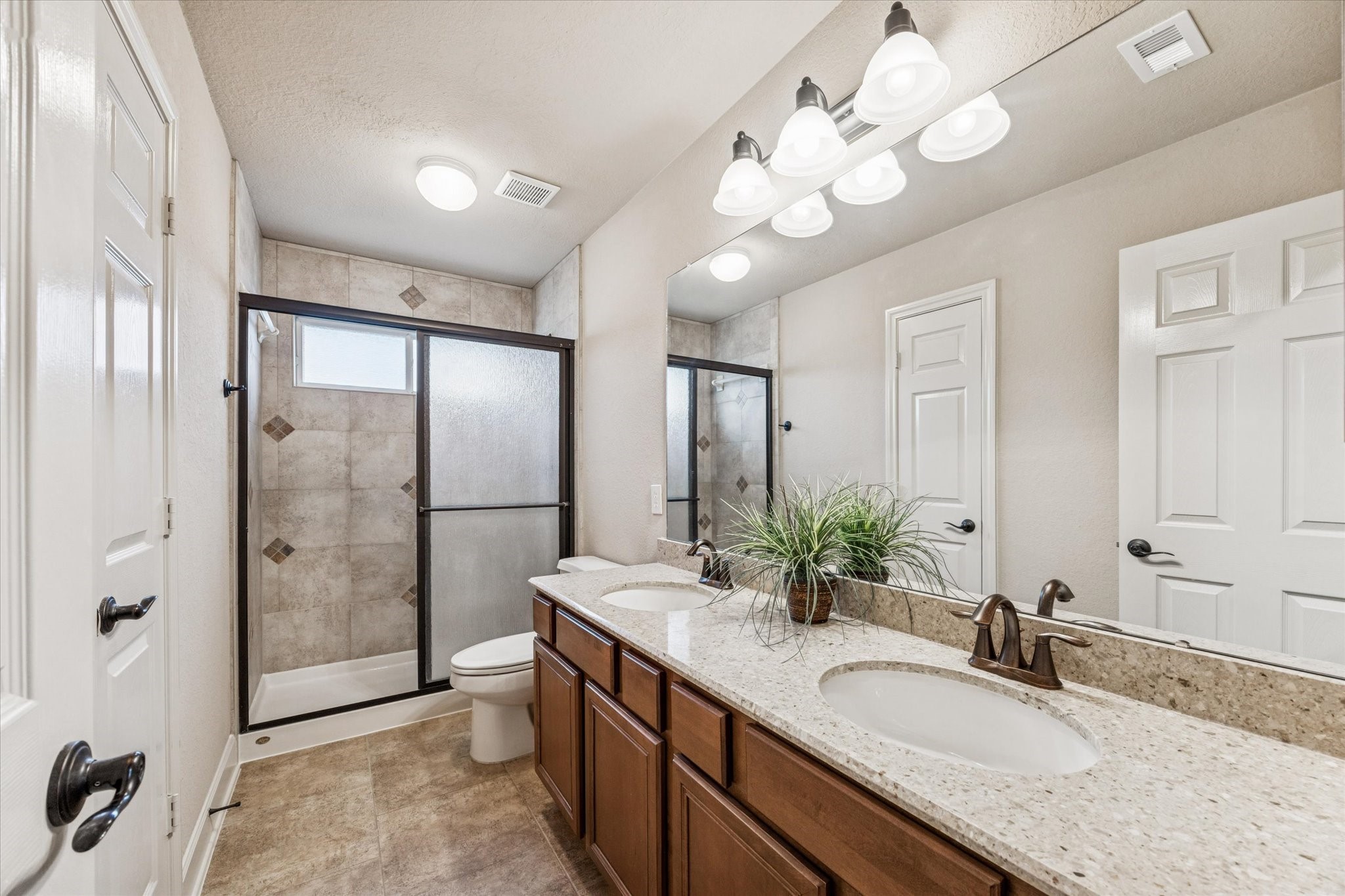 11256 Hahn Road Sealy, TX 77474 - Photo 13 of 24 Secondary bath offers walk in shower and double sinks