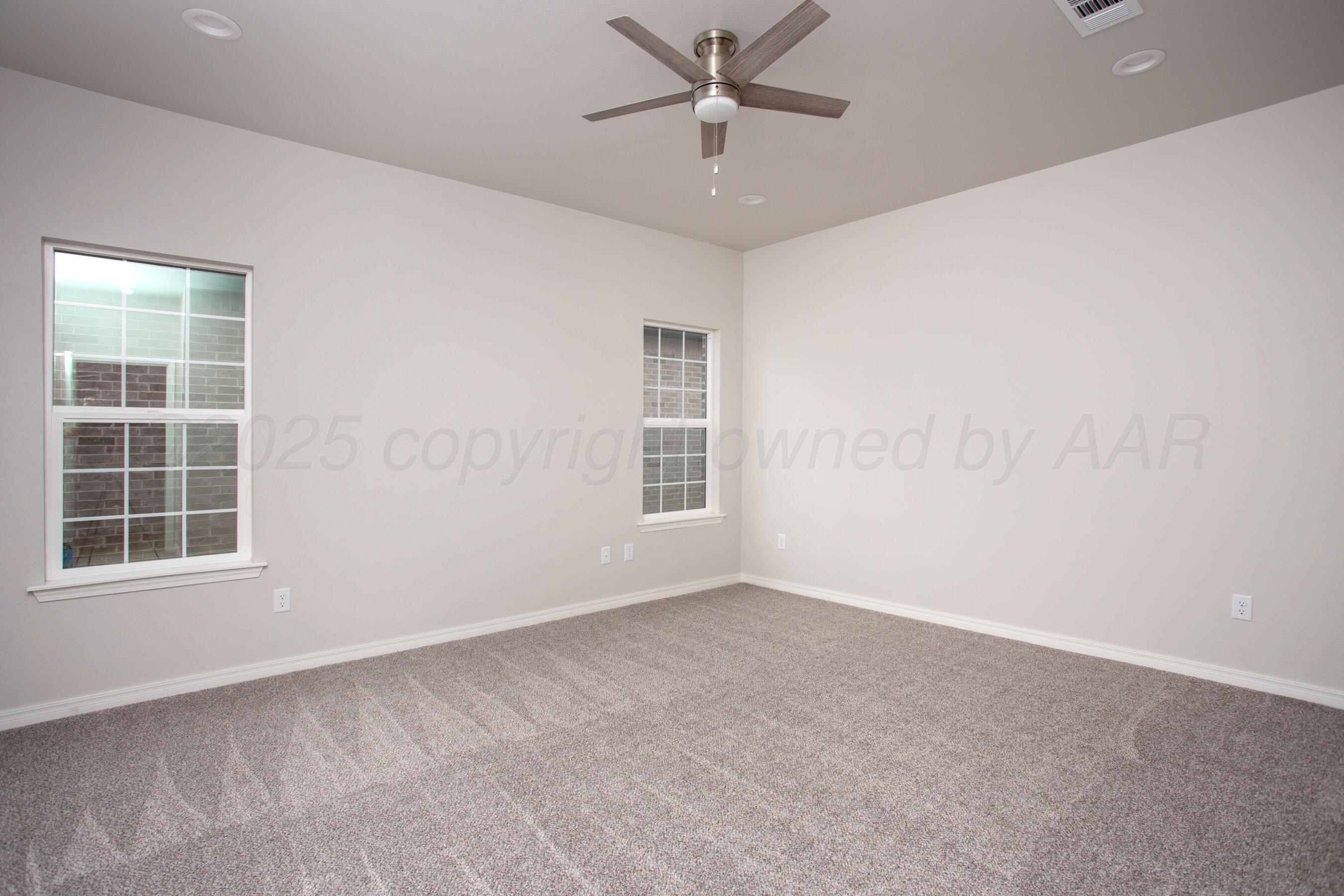 22131 Howard Draw Rd Canyon Canyon, TX 79015 - Photo 15 of 25 an empty room with a window and ceiling fan
