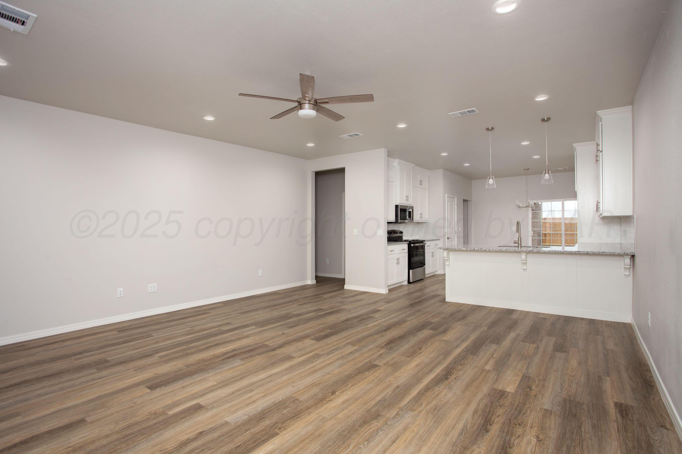 22131 Howard Draw Rd Canyon Canyon, TX 79015 - Photo 4 of 25 a view of kitchen with wooden floor and window