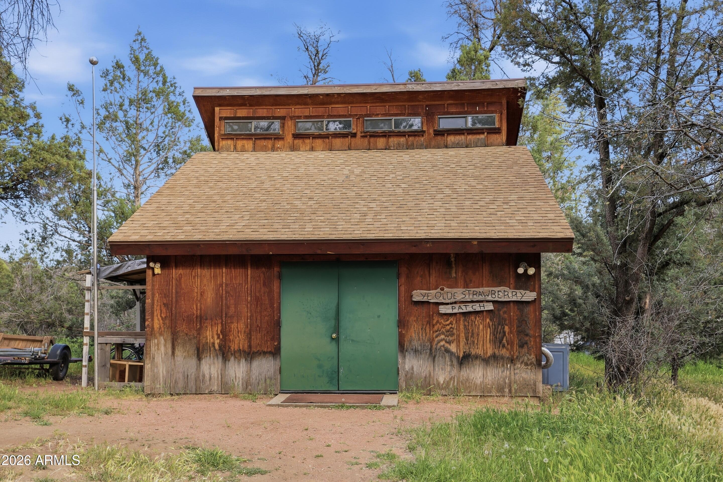 8135 West Gibson Ranch Road Payson, AZ 85541 - Photo 26 of 43 a front view of a house with garden