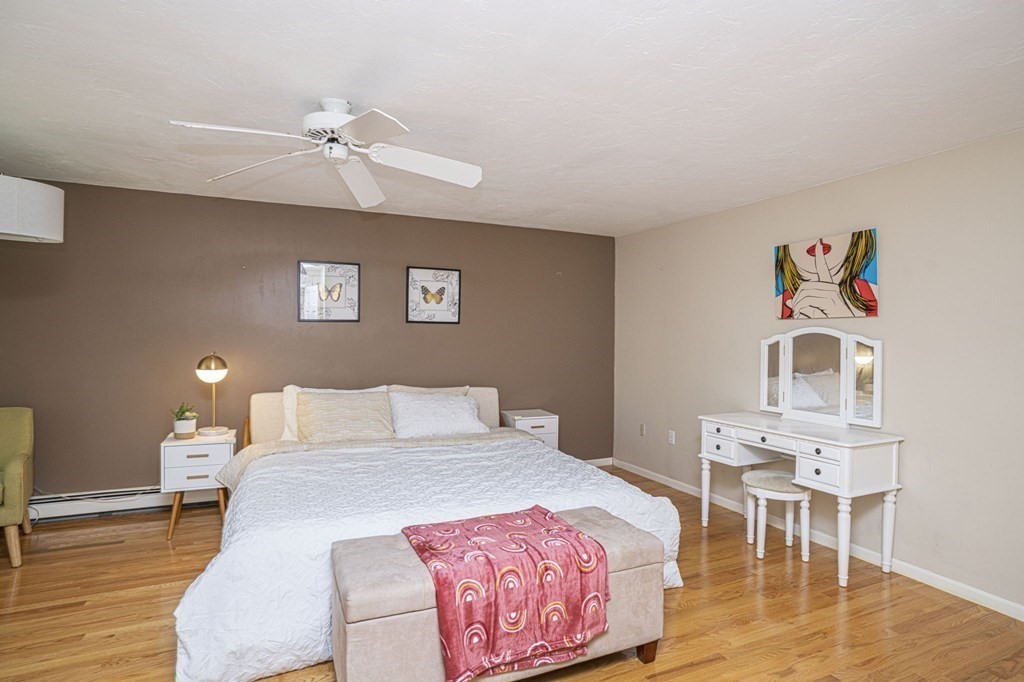 2 Toni Lane Franklin, MA 02038 - Photo 13 of 24 a bedroom with a bed and wooden floor