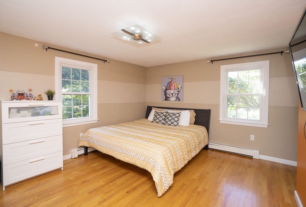 2 Toni Lane Franklin, MA 02038 - Photo 15 of 24 a bedroom with a bed and a window