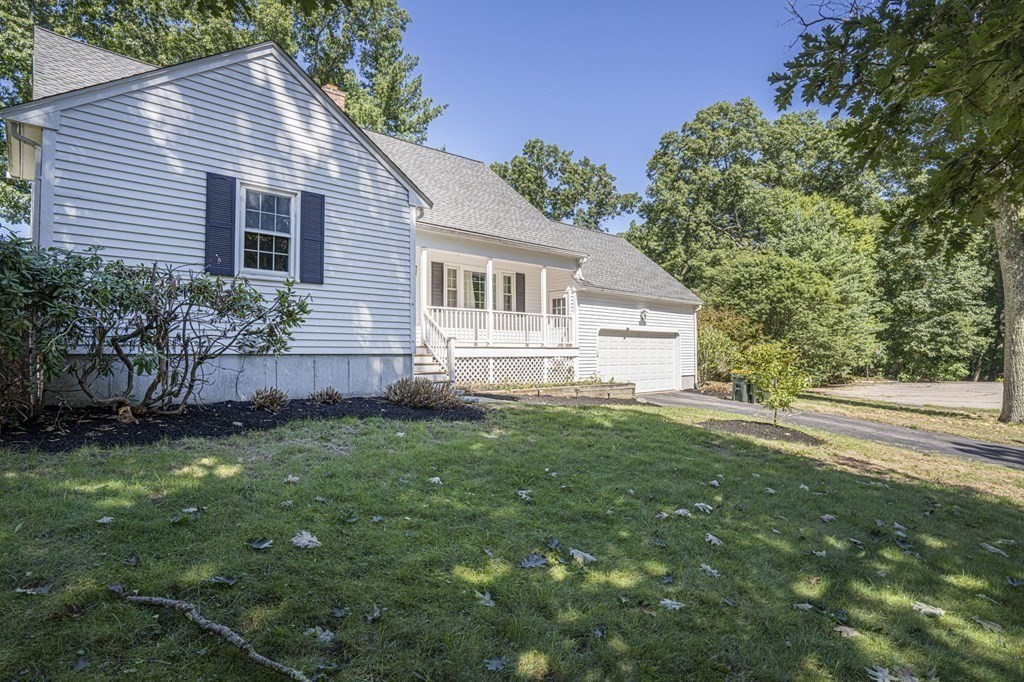 2 Toni Lane Franklin, MA 02038 - Photo 2 of 24 a view of a house with a yard chairs and floor to ceiling window and plants