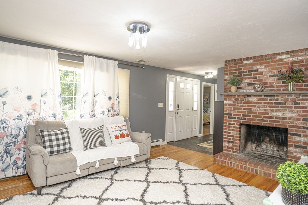 2 Toni Lane Franklin, MA 02038 - Photo 3 of 24 a living room with furniture and a fireplace
