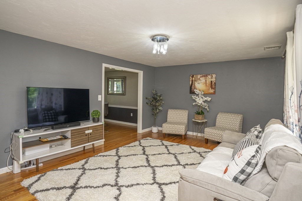 2 Toni Lane Franklin, MA 02038 - Photo 4 of 24 a living room with furniture and a flat screen tv