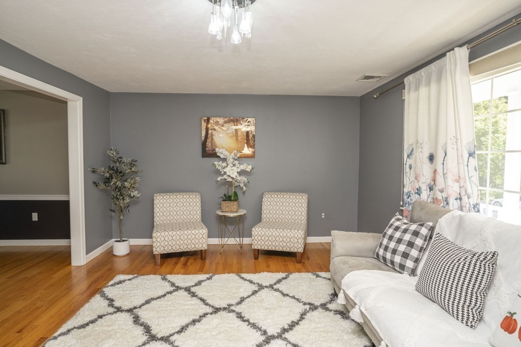 2 Toni Lane Franklin, MA 02038 - Photo 5 of 24 a living room with furniture and a wooden floor