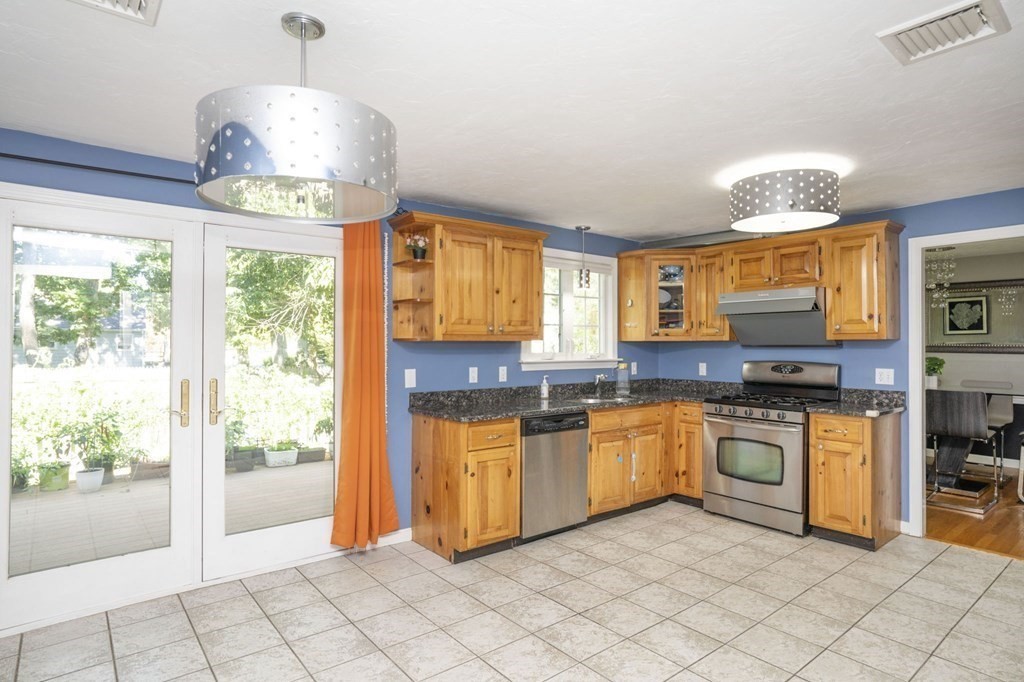 2 Toni Lane Franklin, MA 02038 - Photo 8 of 24 a kitchen with stainless steel appliances granite countertop a stove and cabinets
