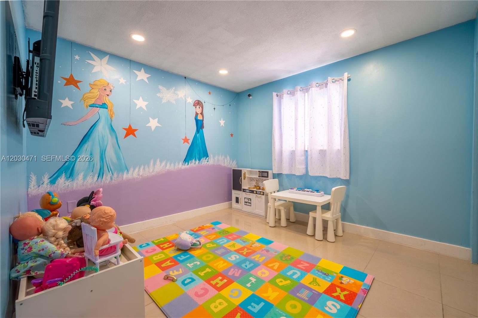 11851 Southwest 181st Street Miami, FL 33177 - Photo 4 of 25 a playing room with toys and a wooden floor