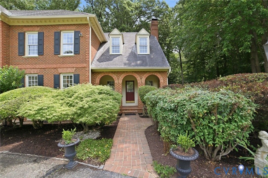 3950 Reeds Landing Circle Midlothian, VA 23113 - Photo 45 of 50 a front view of a house with a garden