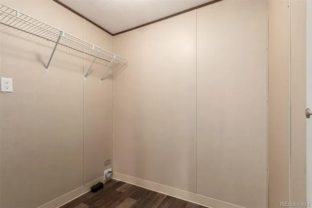 a view of small space with empty racks on the wall