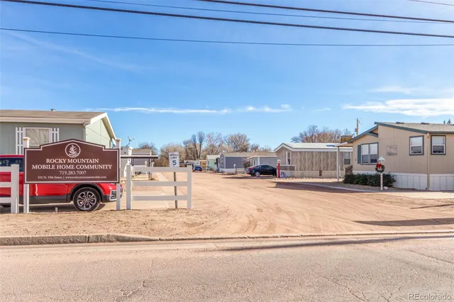 a utility room with a bed and a table