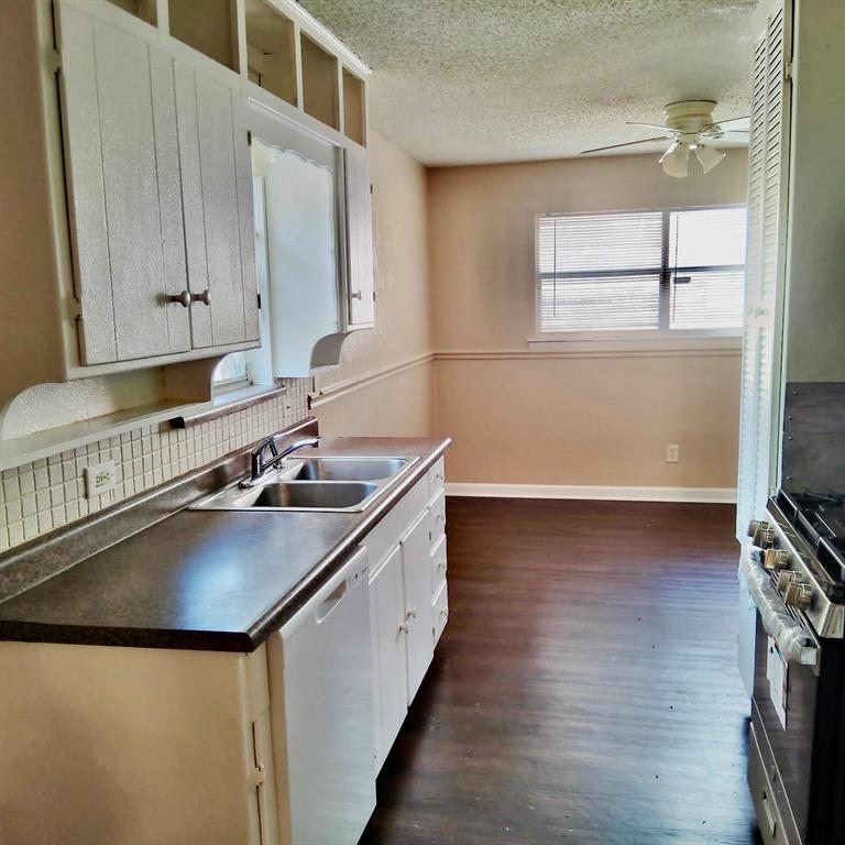 913 Irwin Drive Hurst, TX 76053 - Photo 5 of 8 a kitchen with a sink a window and appliances