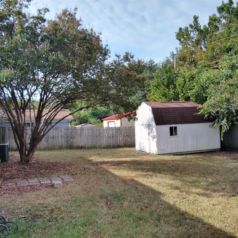 913 Irwin Drive Hurst, TX 76053 - Photo 8 of 8 a front view of a house with a yard and tree s