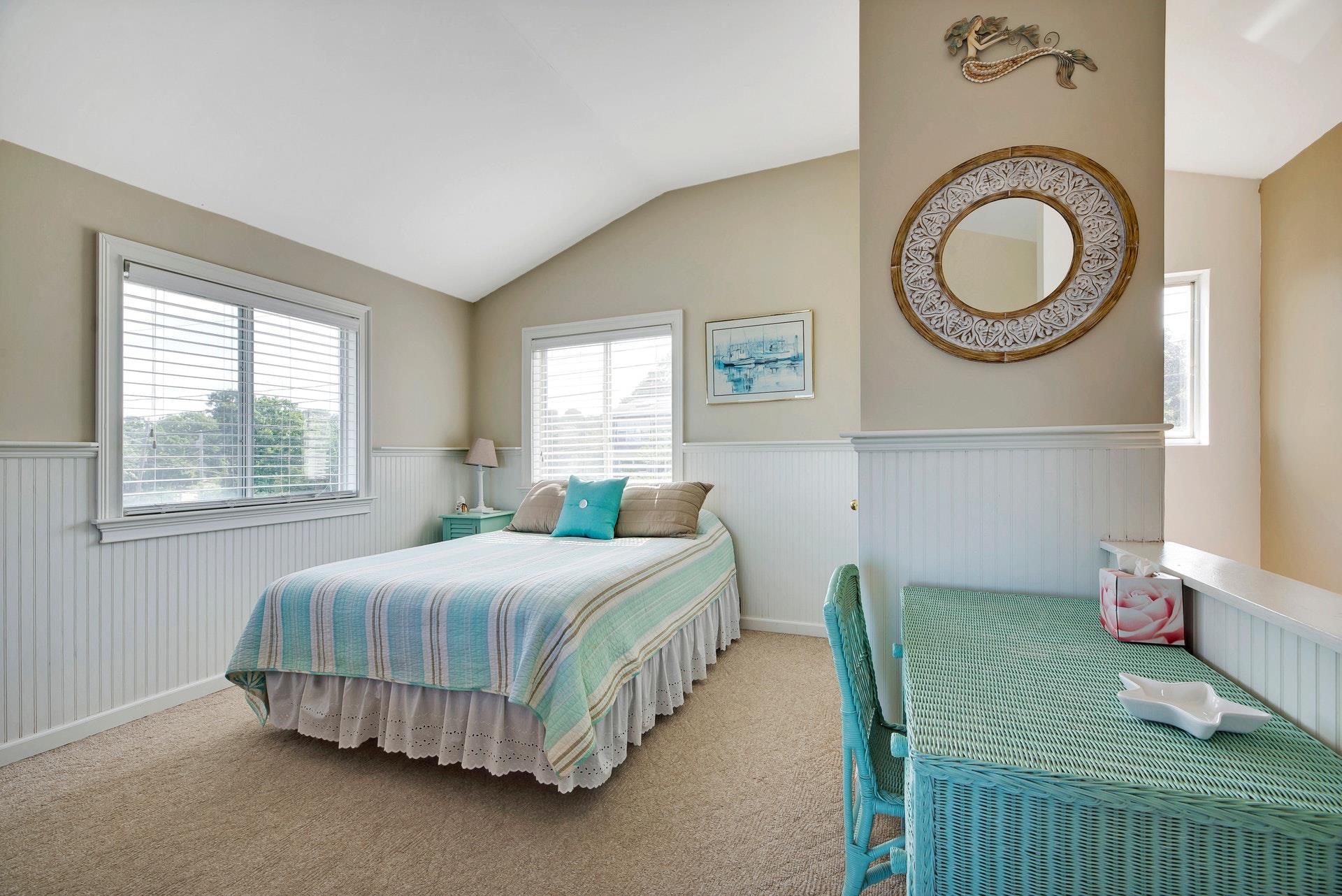 11 Oakhurst Road Hampton Bays, NY 11946 - Photo 11 of 20 a bedroom with a bed and a window