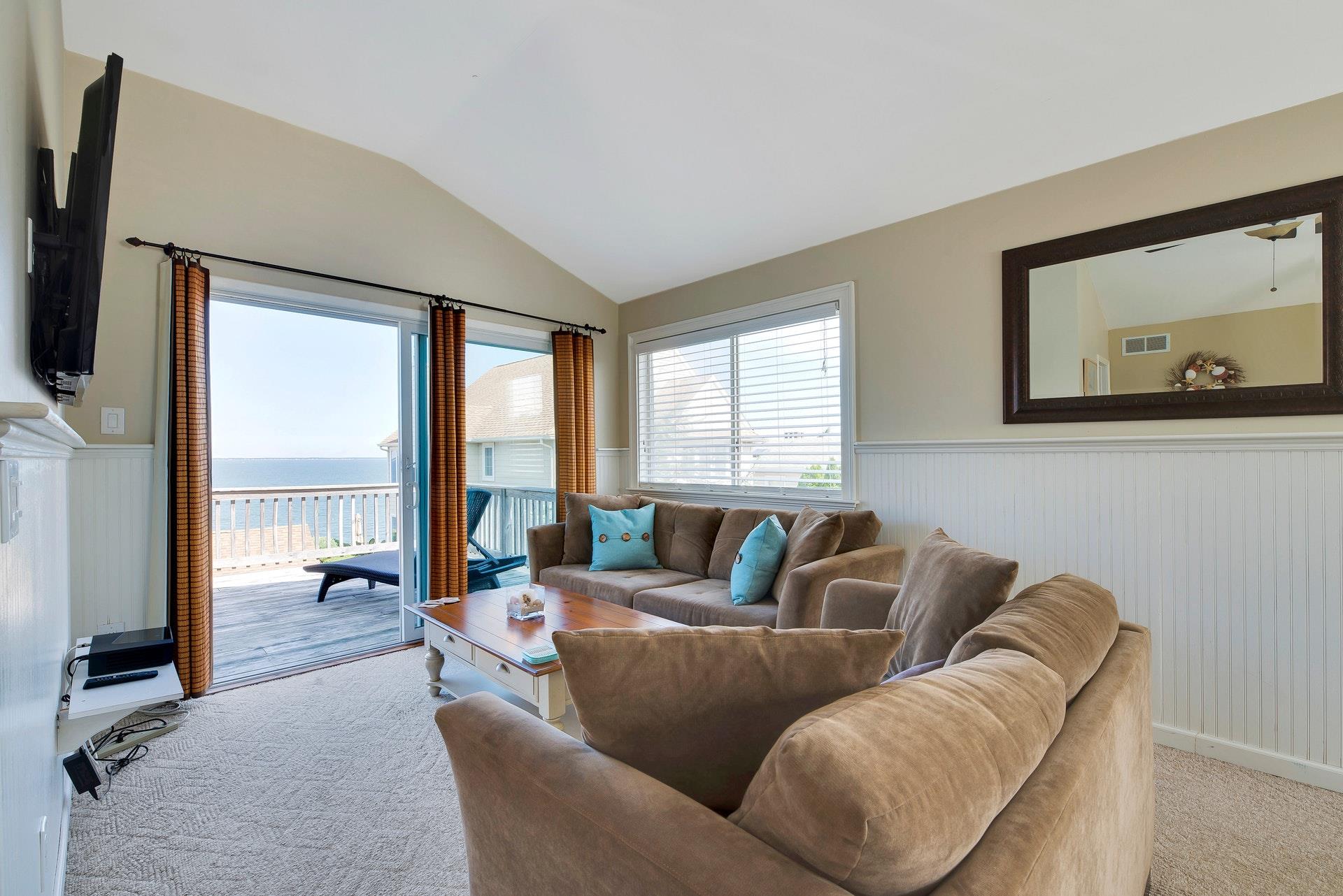 11 Oakhurst Road Hampton Bays, NY 11946 - Photo 4 of 20 a living room with furniture and a large window