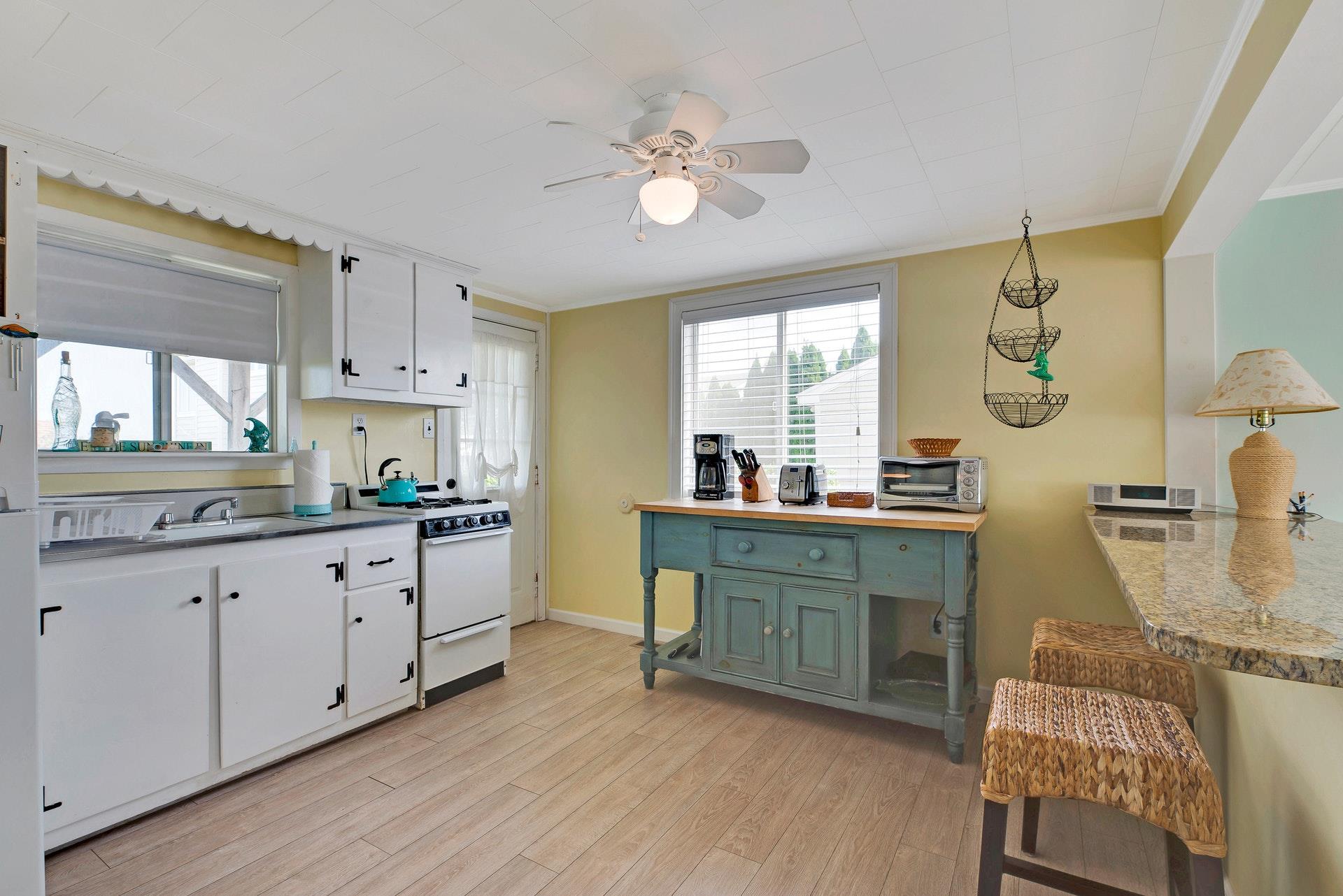 11 Oakhurst Road Hampton Bays, NY 11946 - Photo 7 of 20 a kitchen with sink and cabinets