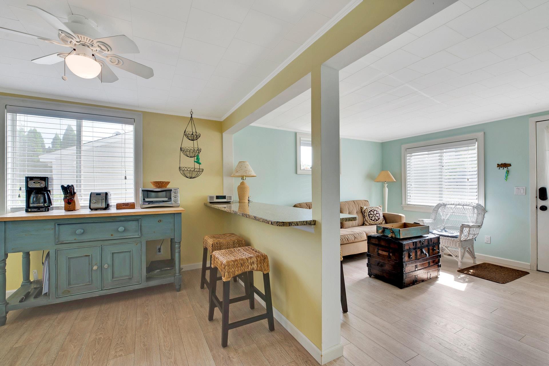 11 Oakhurst Road Hampton Bays, NY 11946 - Photo 8 of 20 a living room with furniture and wooden floor