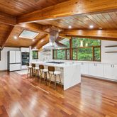 a view of a room with wooden floor
