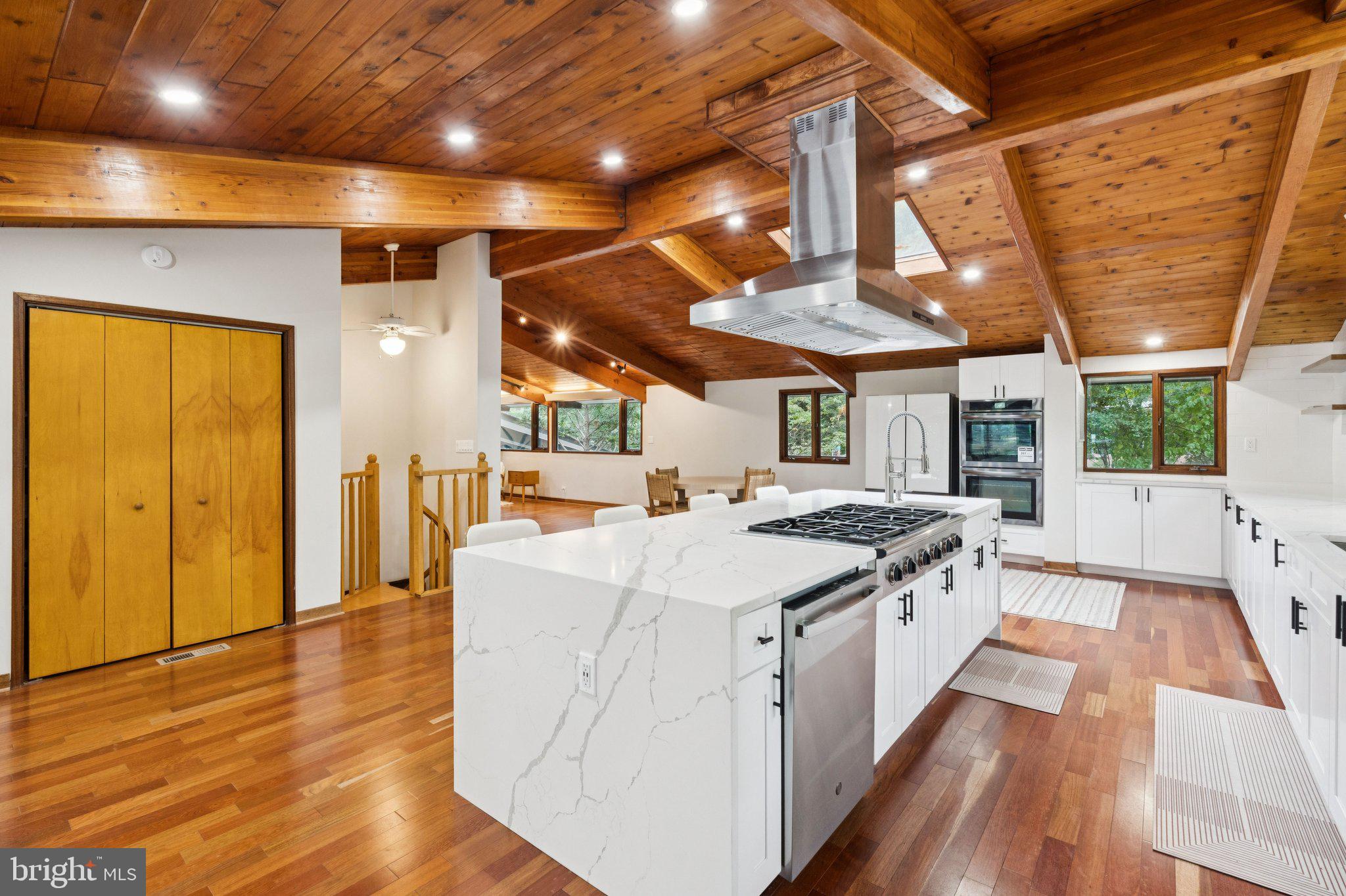 11428 Purple Beech Drive Reston, VA 20191 - Photo 11 of 52 a large kitchen with stainless steel appliances granite countertop a large stove a sink and a dishwasher