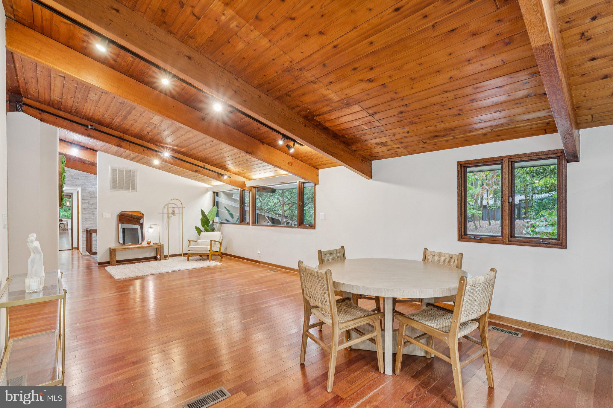 11428 Purple Beech Drive Reston, VA 20191 - Photo 12 of 52 a view of a dining room with furniture and wooden floor
