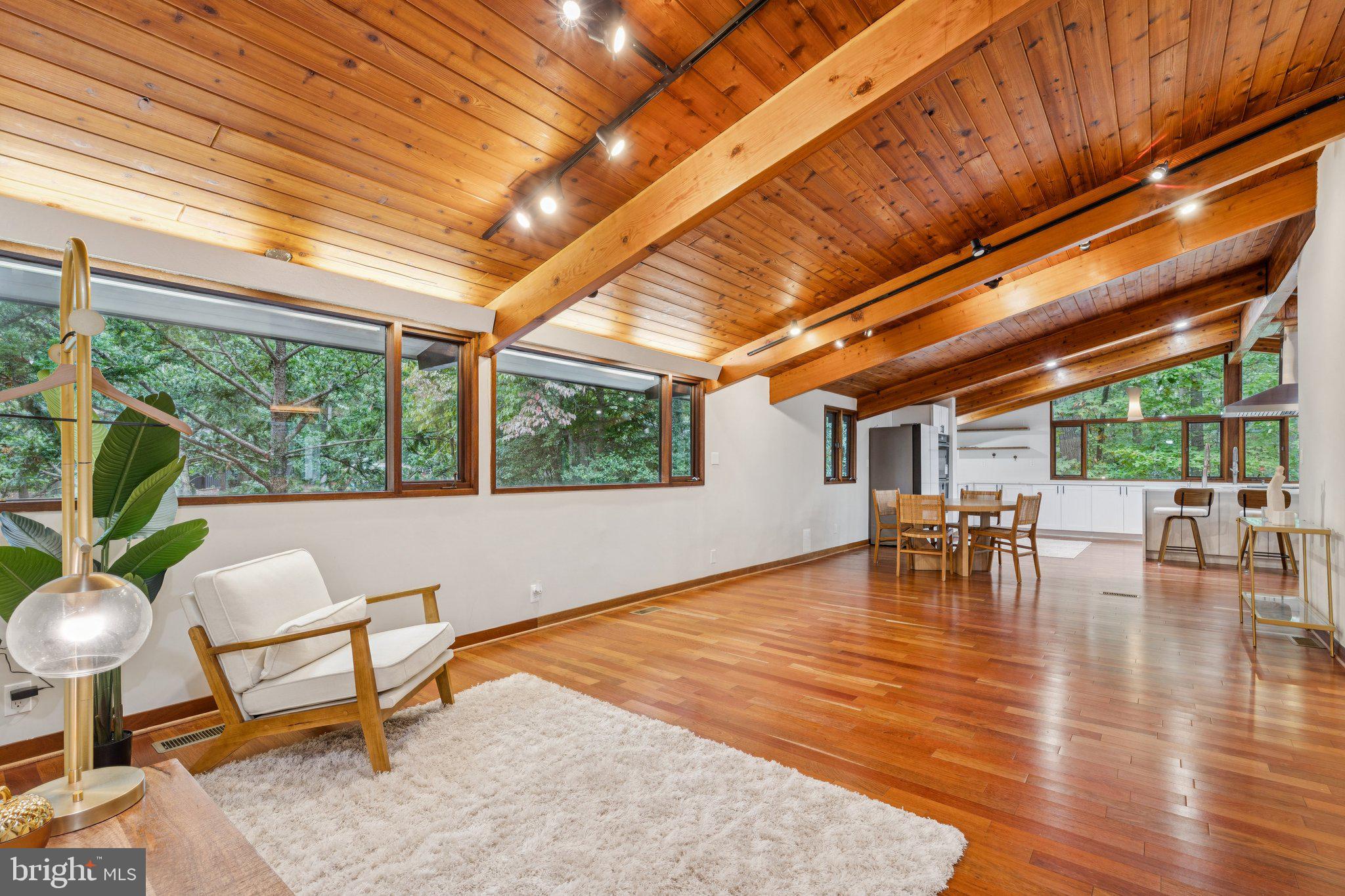 11428 Purple Beech Drive Reston, VA 20191 - Photo 13 of 52 a dining room with furniture a rug and a large window