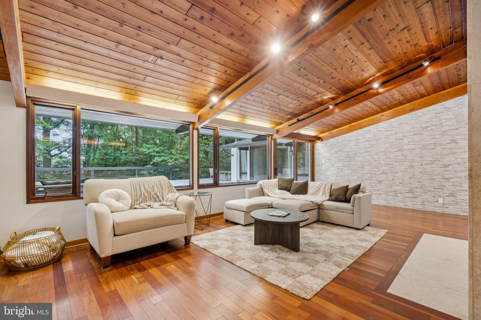 11428 Purple Beech Drive Reston, VA 20191 - Photo 14 of 52 a living room with furniture and a large window