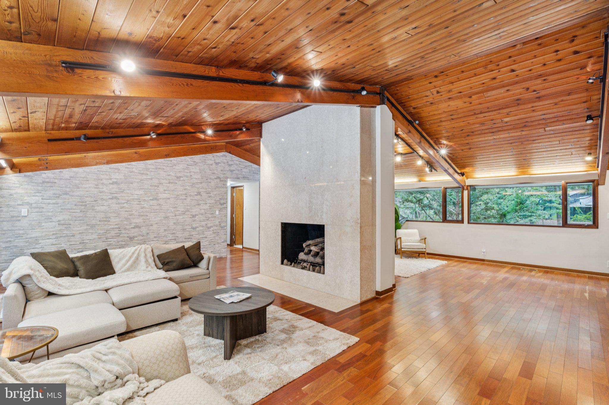 11428 Purple Beech Drive Reston, VA 20191 - Photo 15 of 52 a outdoor space with patio couch and a fireplace