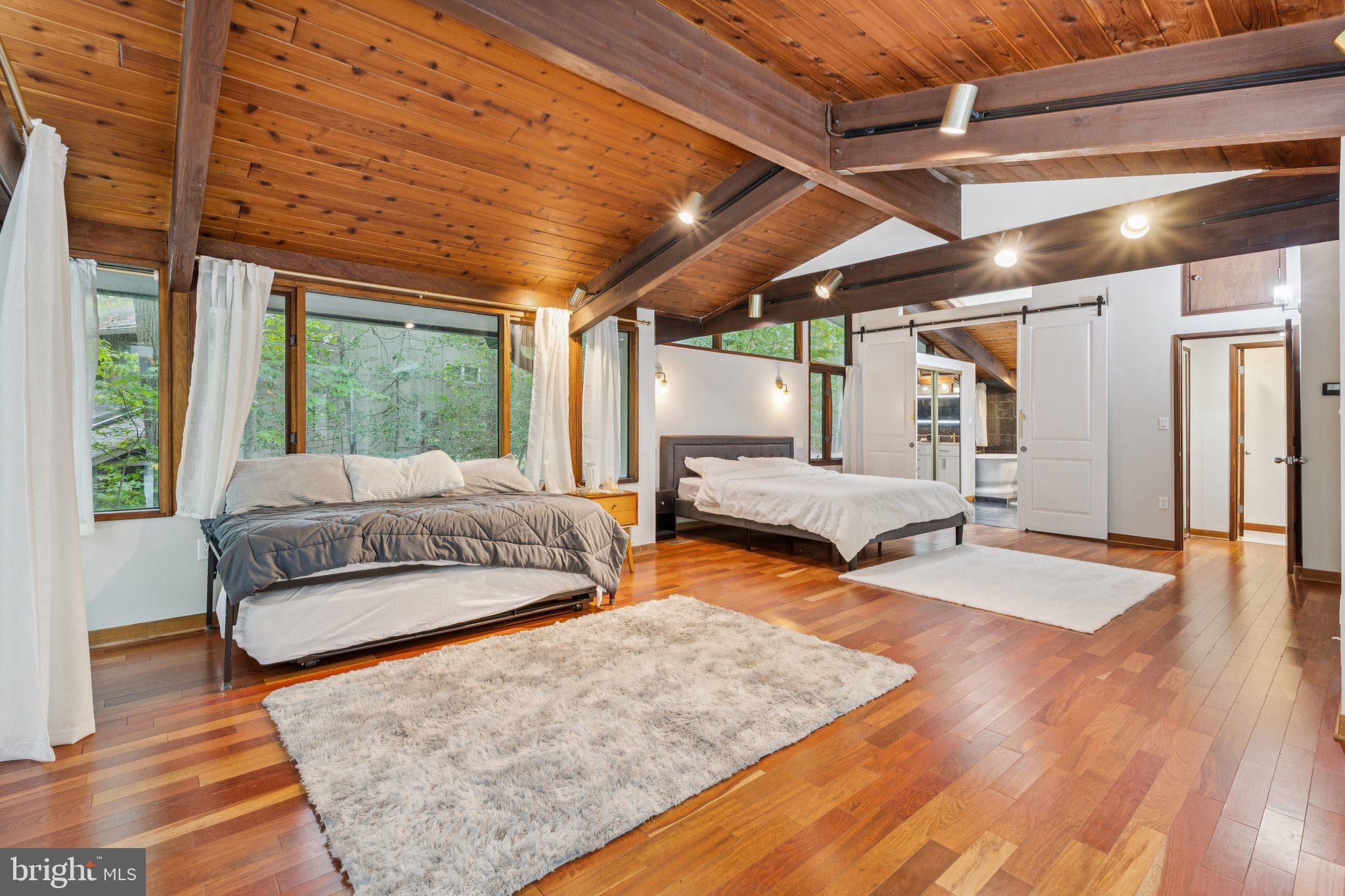 11428 Purple Beech Drive Reston, VA 20191 - Photo 18 of 52 a bedroom with furniture and a wooden floor