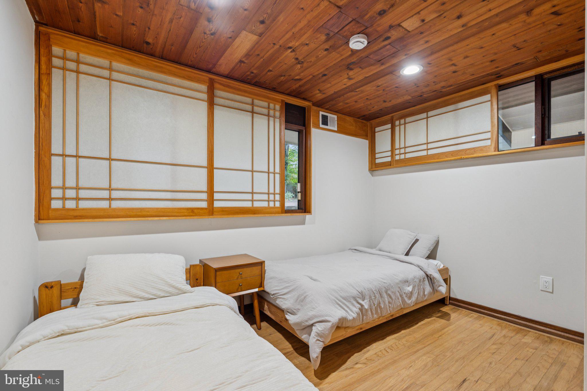 11428 Purple Beech Drive Reston, VA 20191 - Photo 20 of 52 a bedroom with a bed and a window