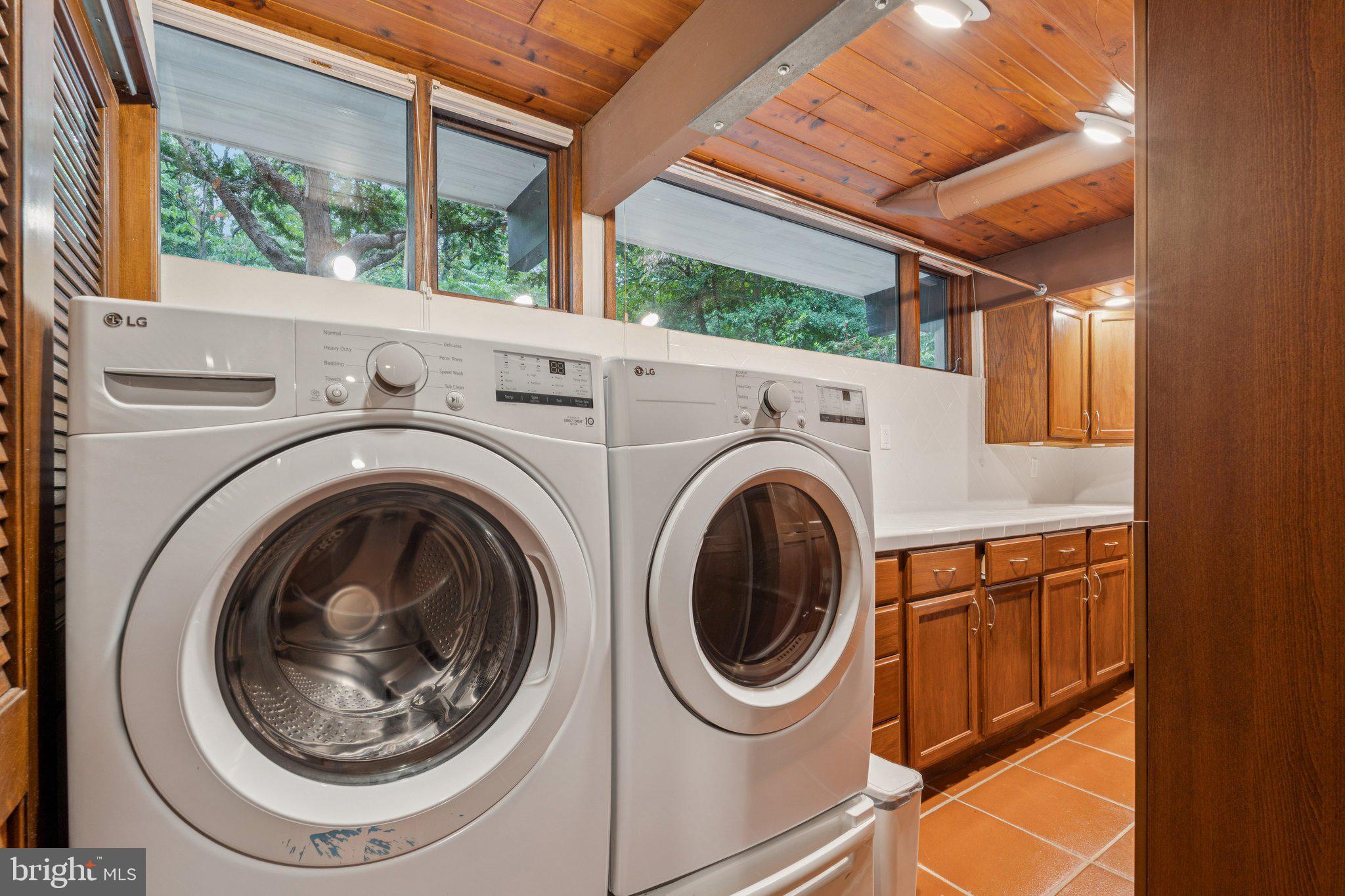 11428 Purple Beech Drive Reston, VA 20191 - Photo 21 of 52 a utility room with dryer and washer