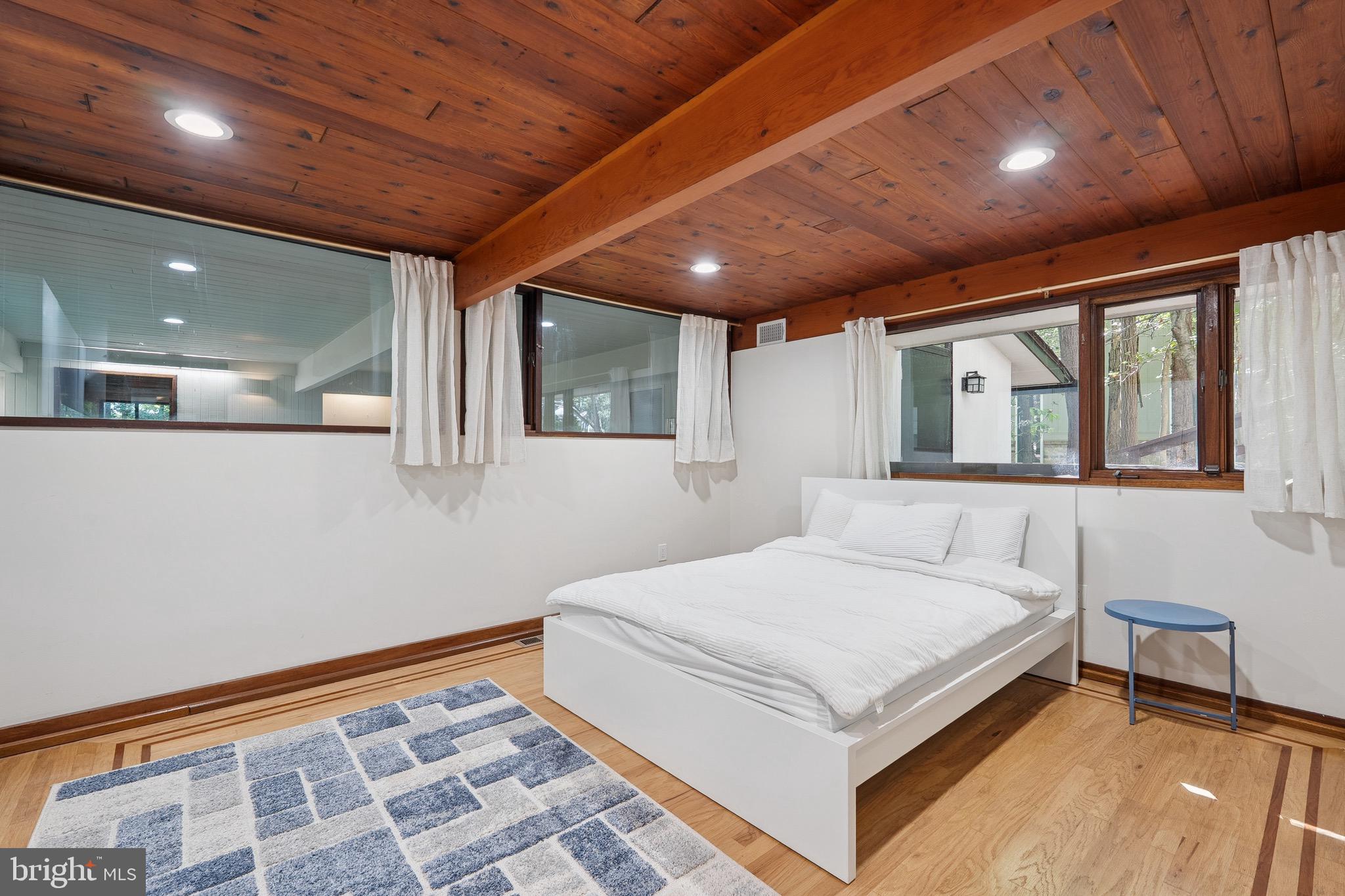 11428 Purple Beech Drive Reston, VA 20191 - Photo 24 of 52 a bedroom with a large bed and a window