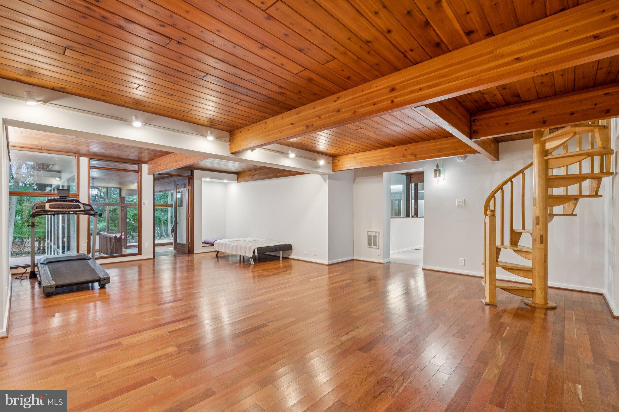 11428 Purple Beech Drive Reston, VA 20191 - Photo 26 of 52 a view of an empty room with wooden floor and a window