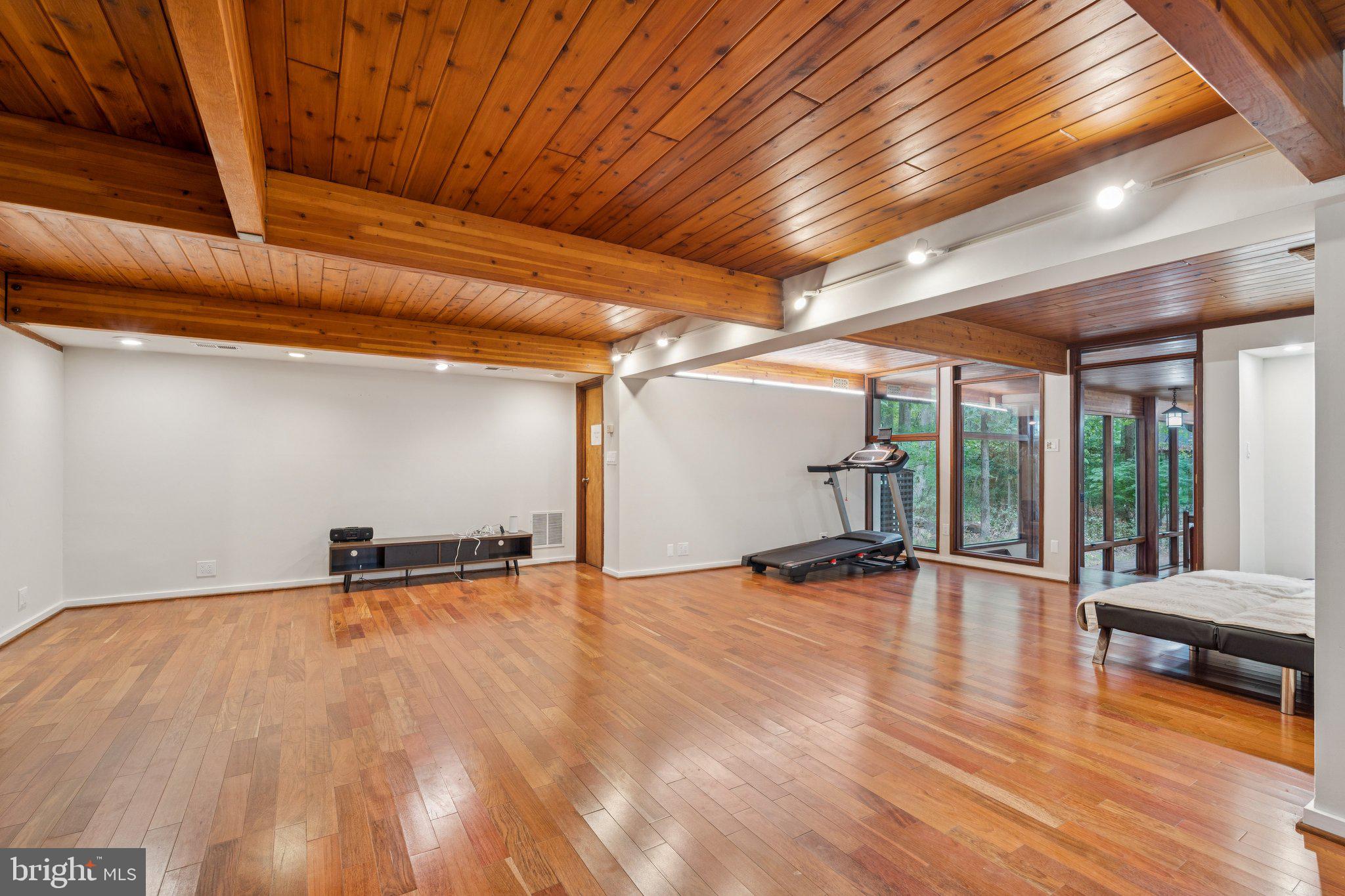 11428 Purple Beech Drive Reston, VA 20191 - Photo 27 of 52 a view of an empty room with window and hardwood