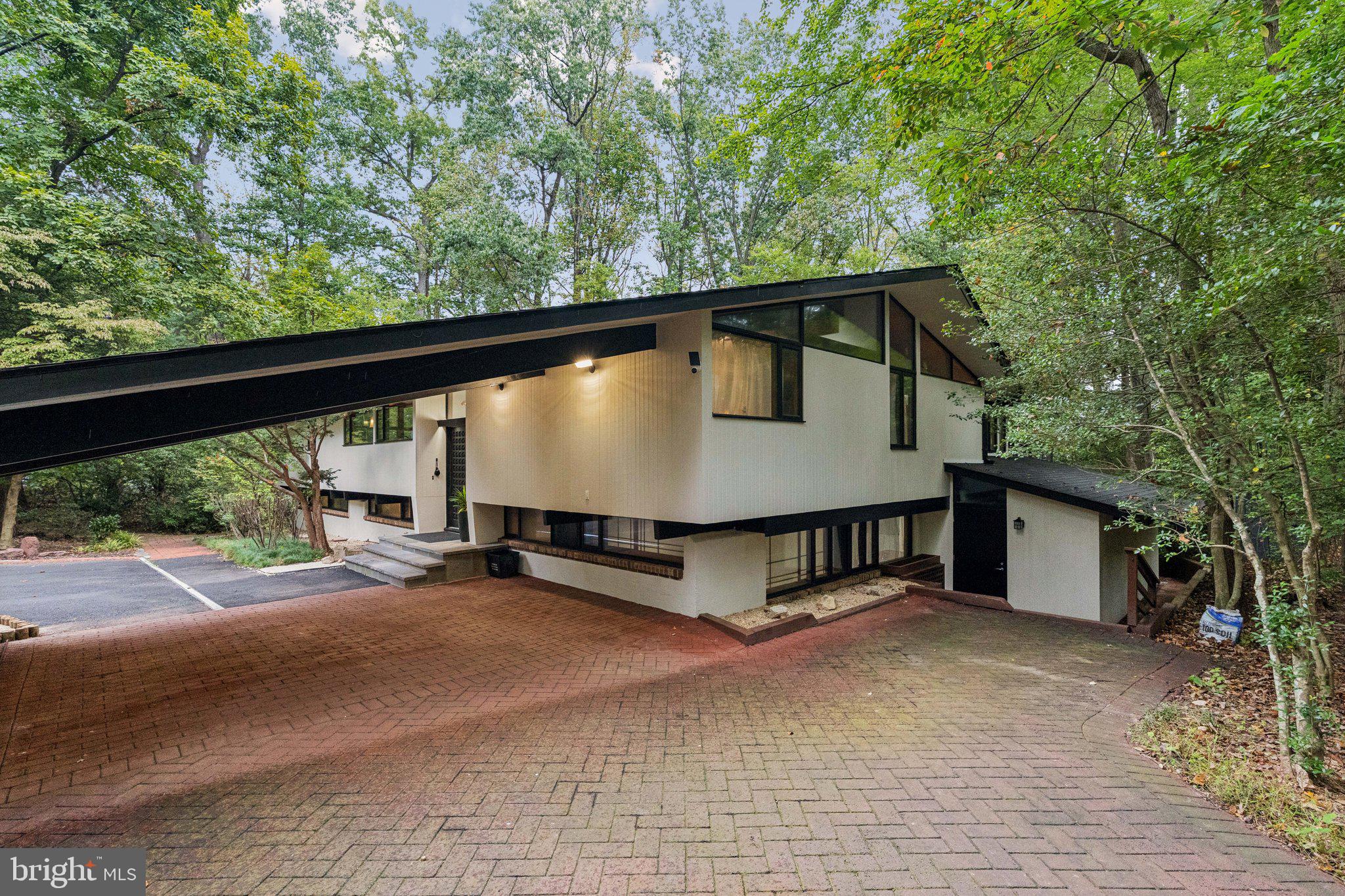 11428 Purple Beech Drive Reston, VA 20191 - Photo 3 of 52 a view of house with backyard and sitting area