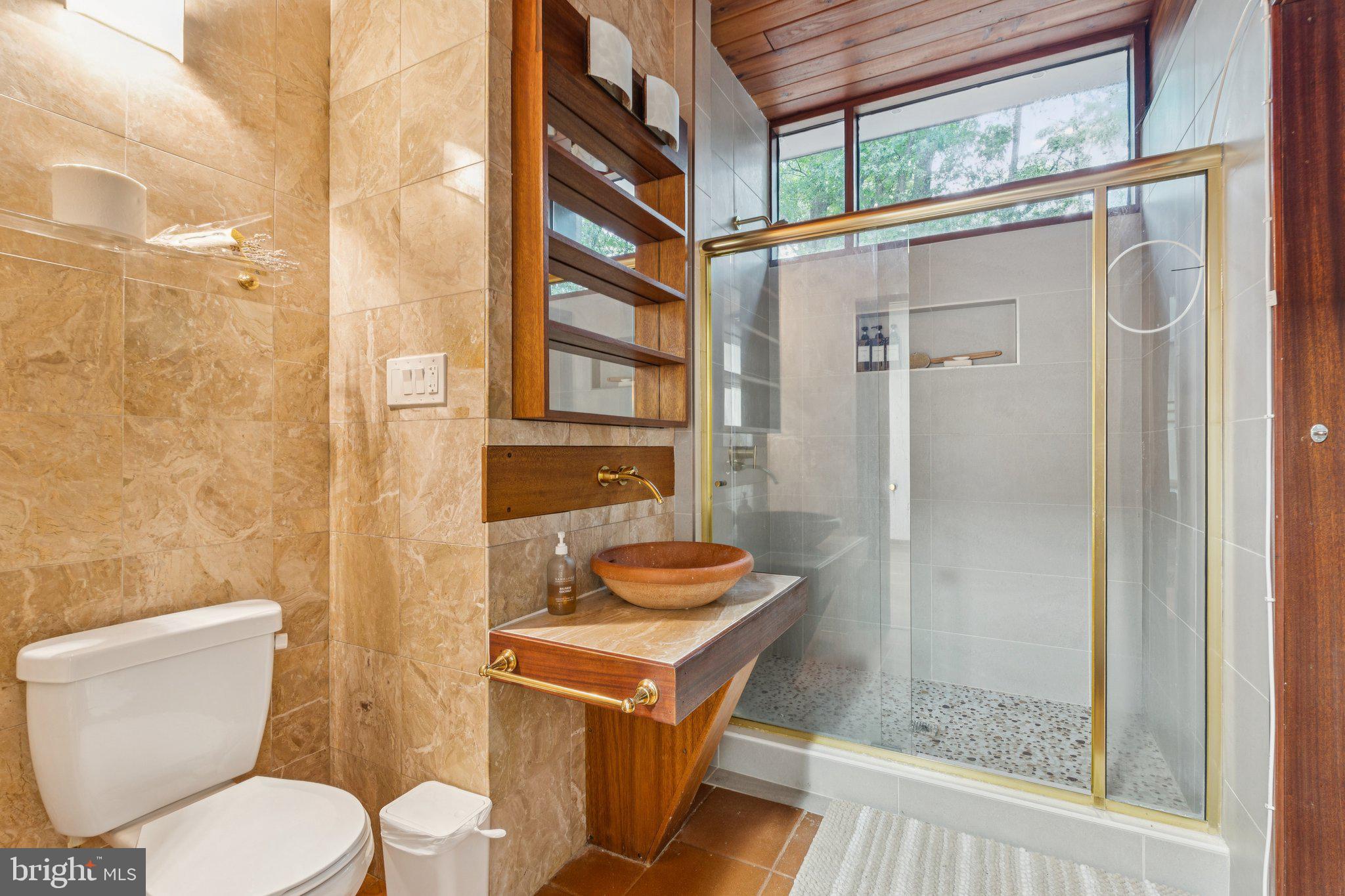11428 Purple Beech Drive Reston, VA 20191 - Photo 36 of 52 a bathroom with a sink toilet and shower
