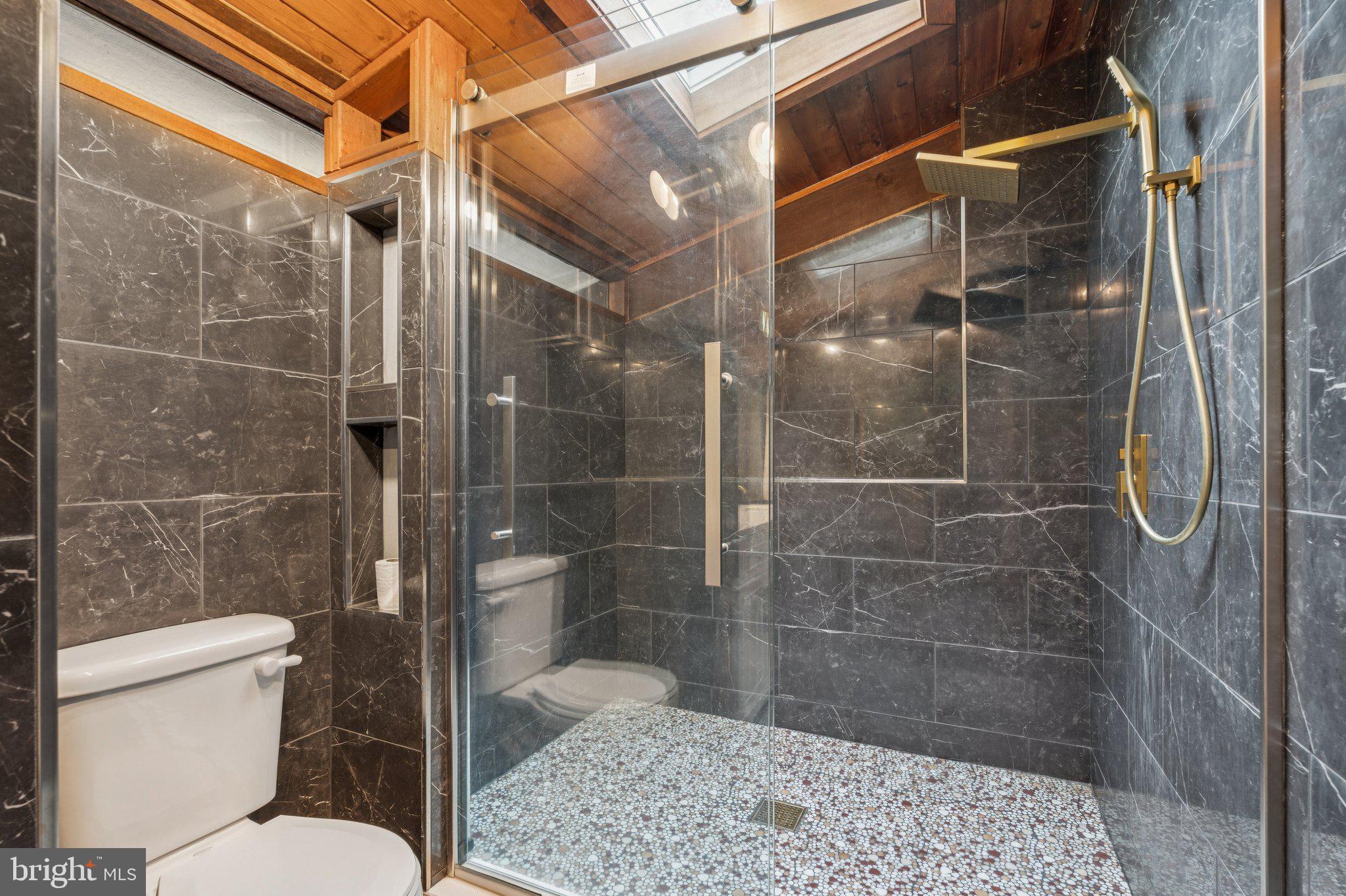 11428 Purple Beech Drive Reston, VA 20191 - Photo 44 of 52 a bathroom with a shower and toilet