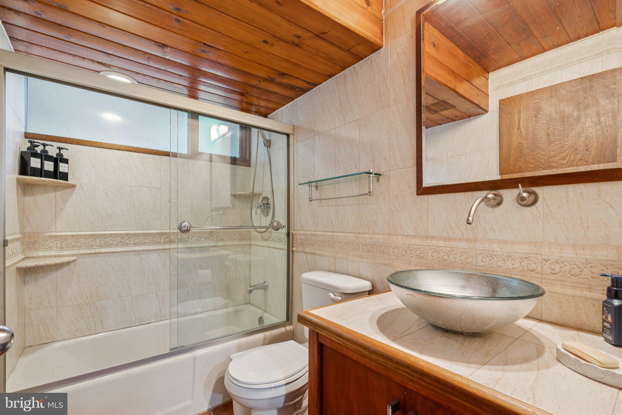 11428 Purple Beech Drive Reston, VA 20191 - Photo 45 of 52 a bathroom with a toilet a sink and shower