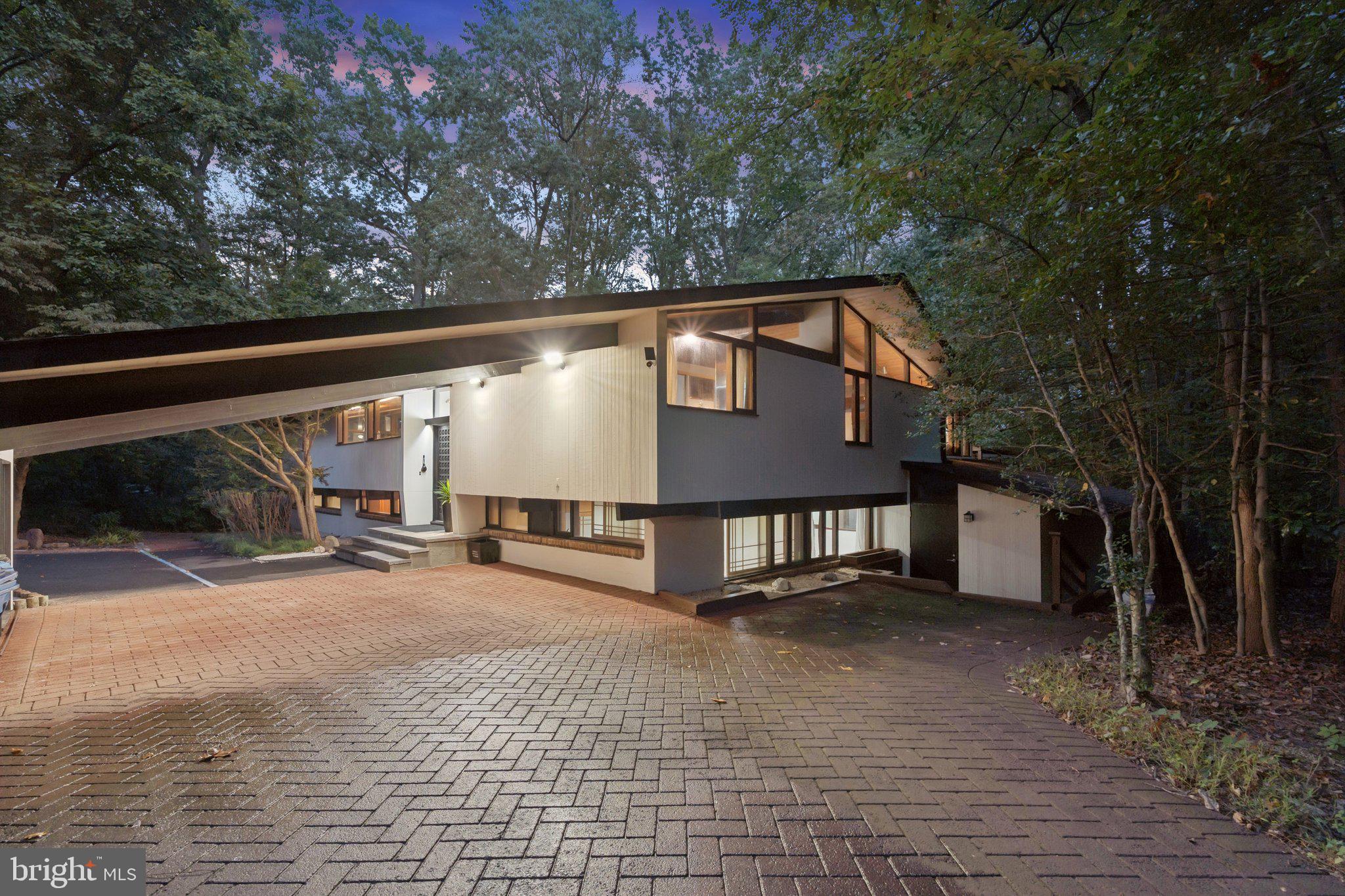 11428 Purple Beech Drive Reston, VA 20191 - Photo 50 of 52 a front view of a house with a yard and garage