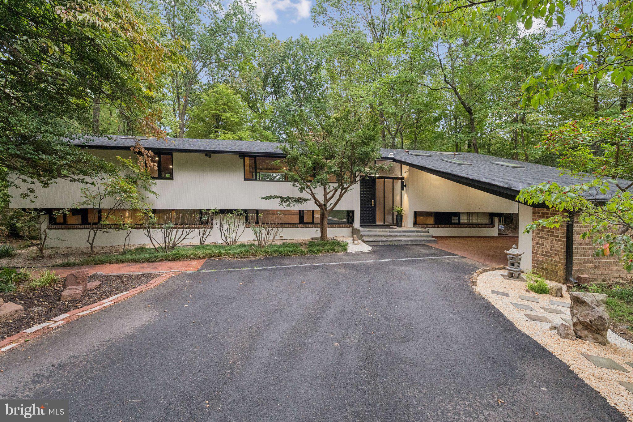11428 Purple Beech Drive Reston, VA 20191 - Photo 52 of 52 a front view of a house with a yard and garage