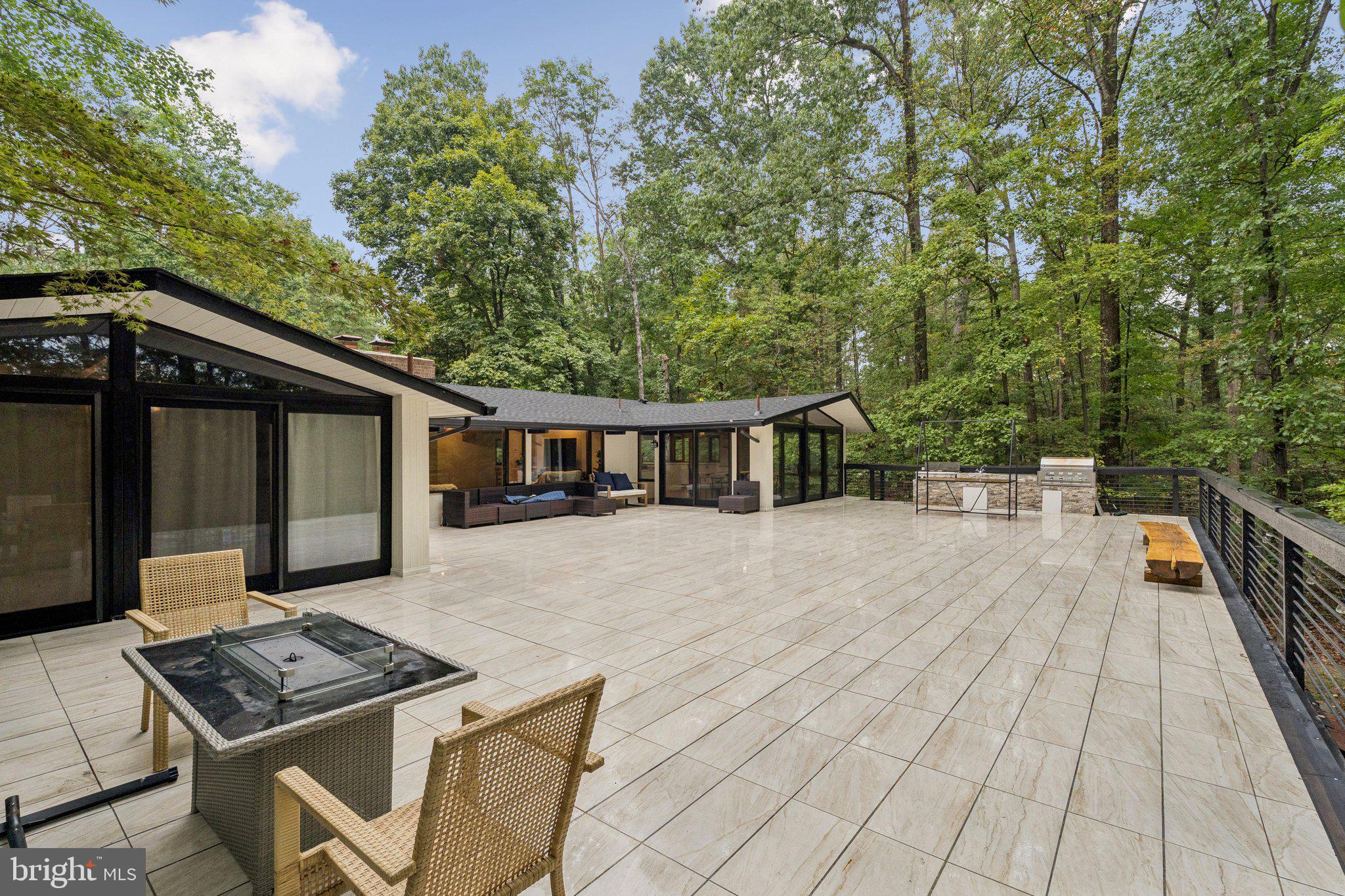 11428 Purple Beech Drive Reston, VA 20191 - Photo 6 of 52 a view of a house with backyard and sitting area